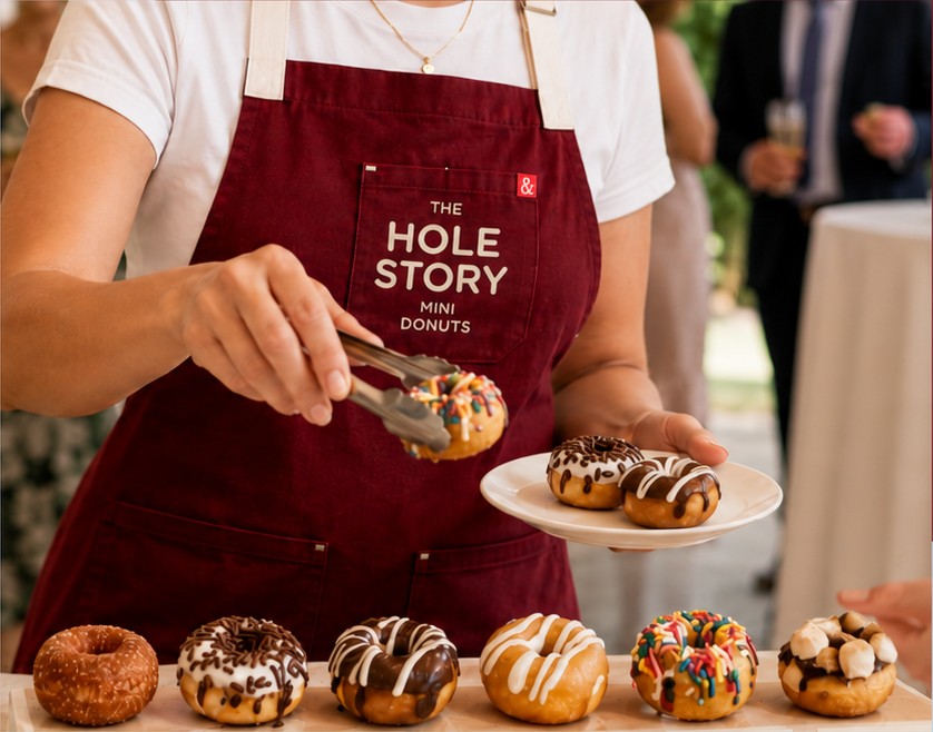 Hole Story server plating hot mini donuts at an Oklahoma City wedding reception